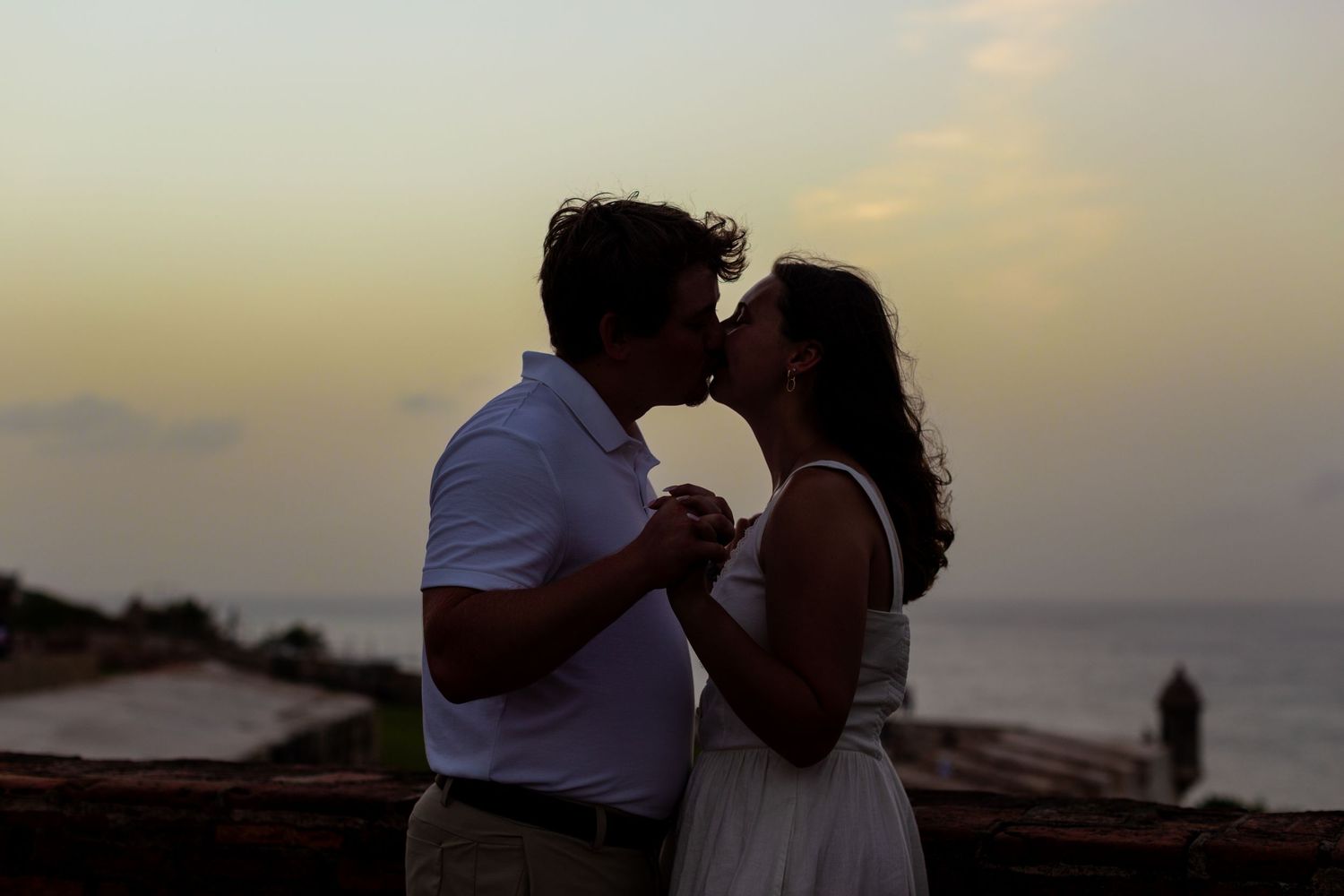 Sunset kissing silhouette. Engagement photo session in Old San Juan, Puerto Rico.
