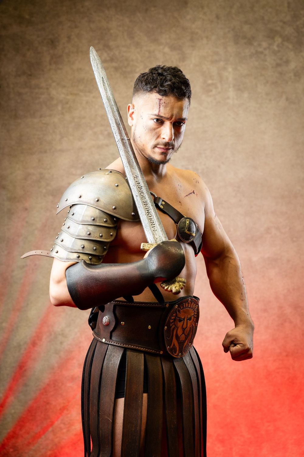 Dramatic shots of gladiator warrior wielding sword in traditional Roman armor.