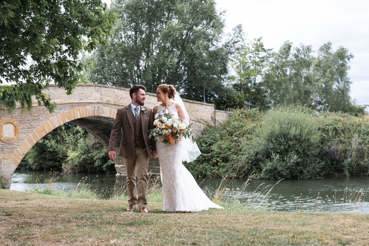 The Trout Tadpole Bride Wedding Photography Bride & Groom with bridge in the background