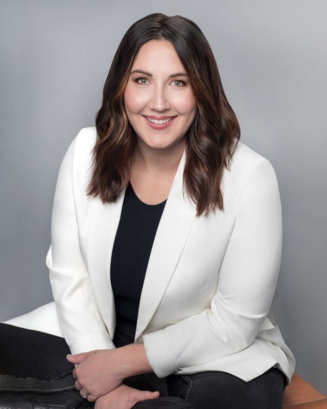 Professional headshot for real estate agent, confident expression and soft lighting