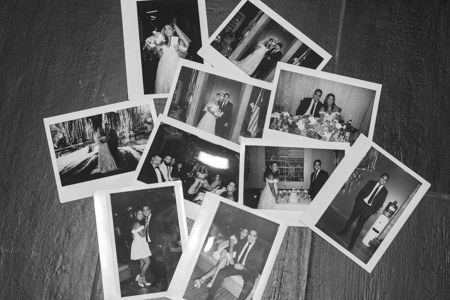 Black and white photographs scattered on a dark surface showing various personal memories and moments.