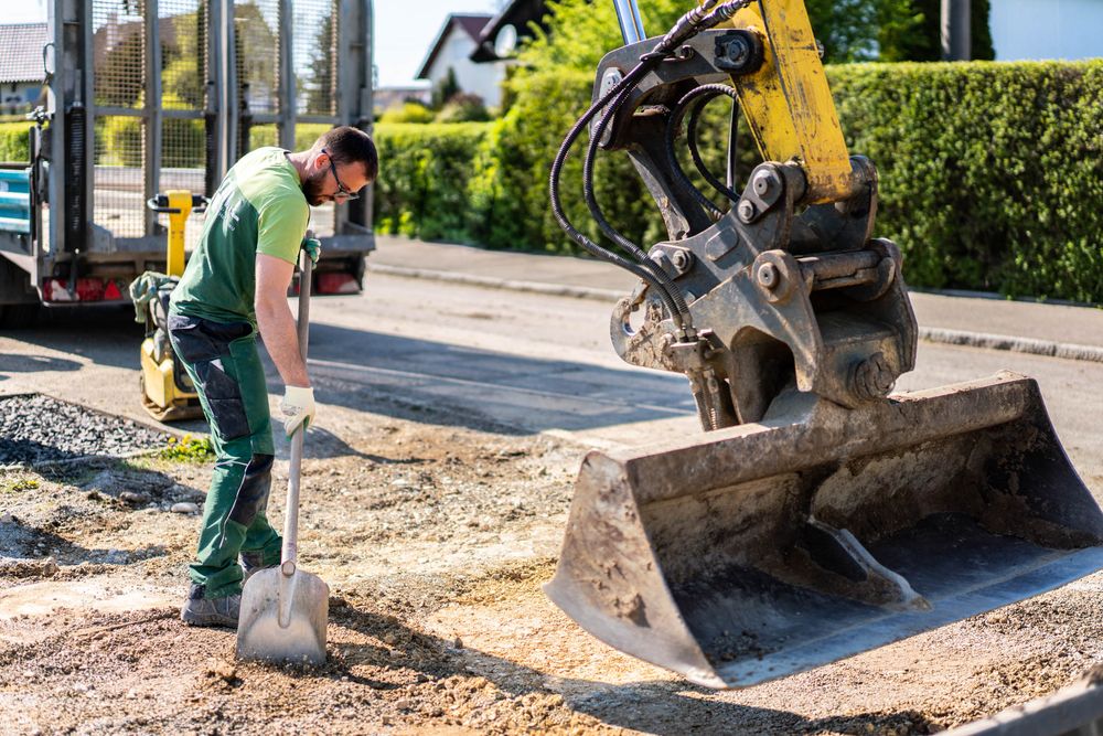 A series of construction images showing excavation equipment and workers preparing gravel for a foundation project.