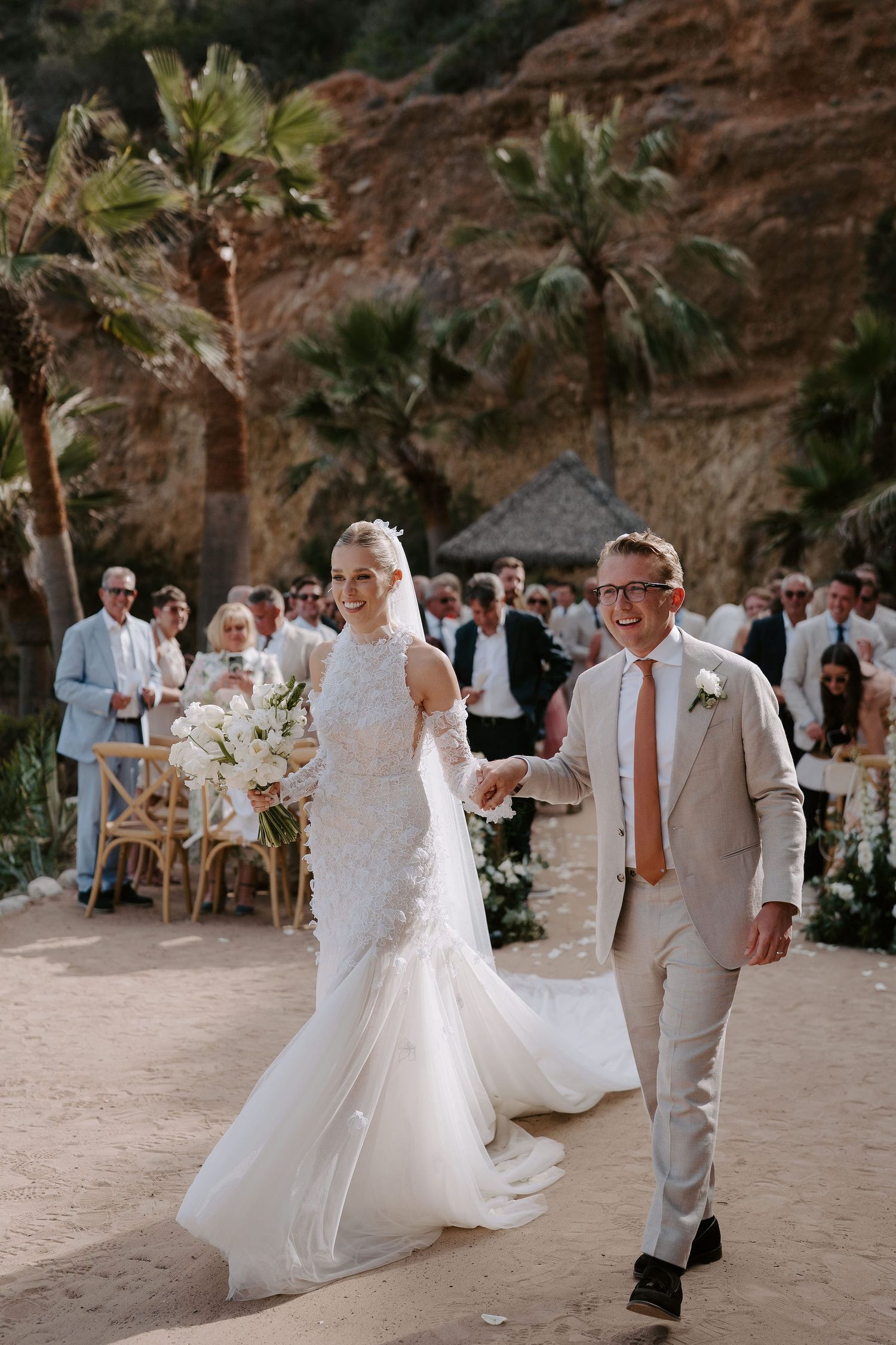 bride and groom exiting wedding ceremony as husband and wife at amante ibiza