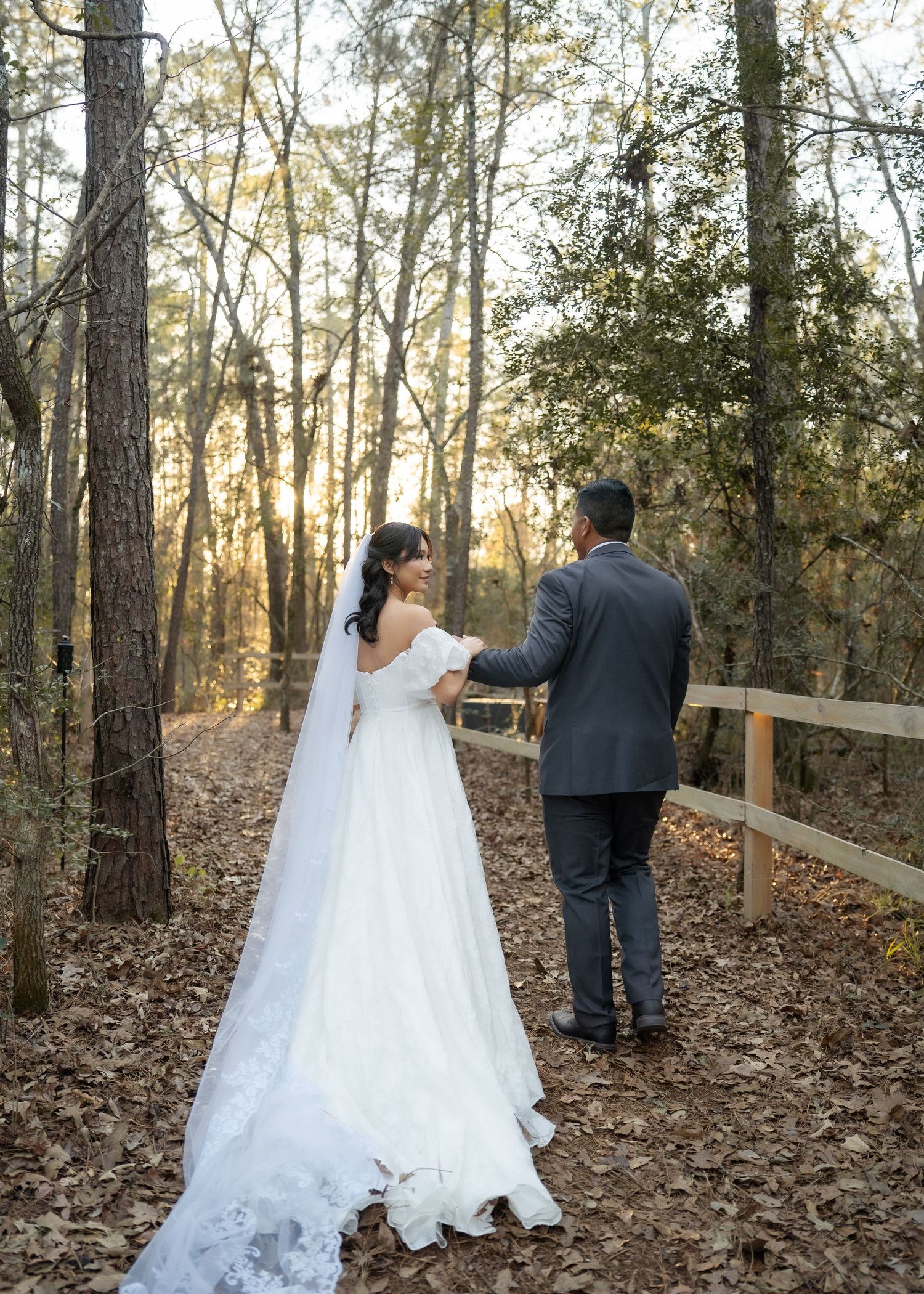 Couple sharing intimate moment in forest during golden hour of their Montgomery Texas elopement