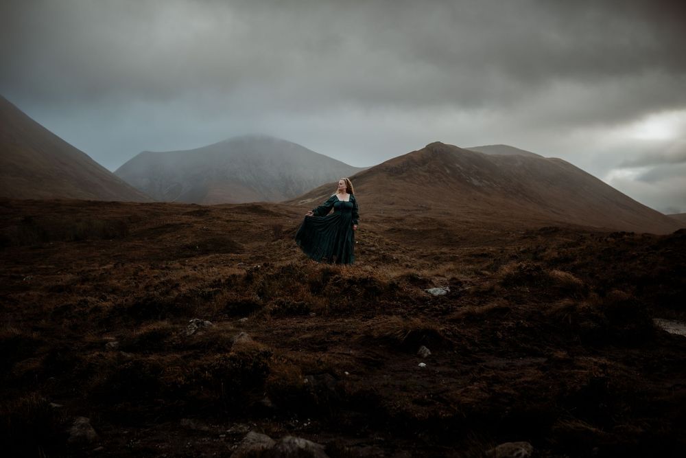 A dramatic series of misty mountain landscapes in Scotland with dark moody clouds rolling over rugged terrain.