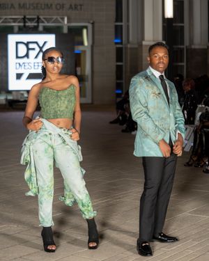 Mint green floral ensemble with matching pants showcased at Columbia Museum runway show.