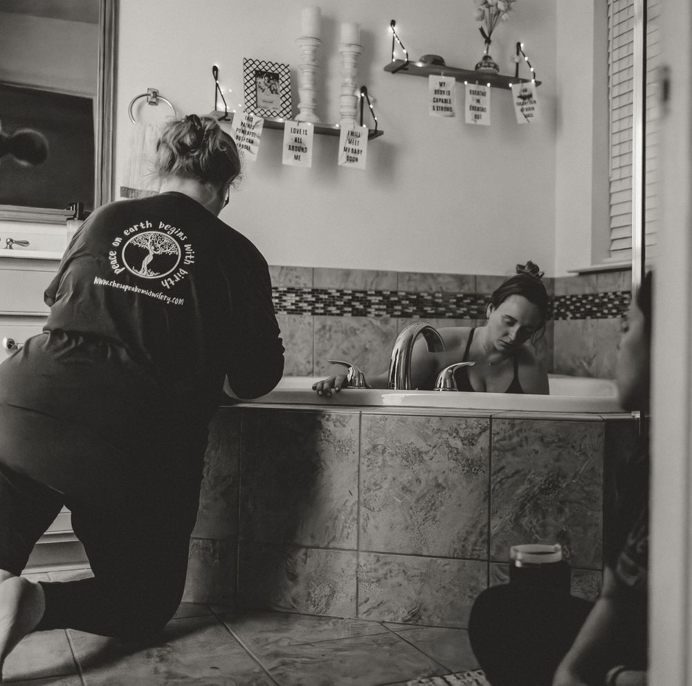 A series of black and white photos showing someone getting a tattoo in a professional studio setting.