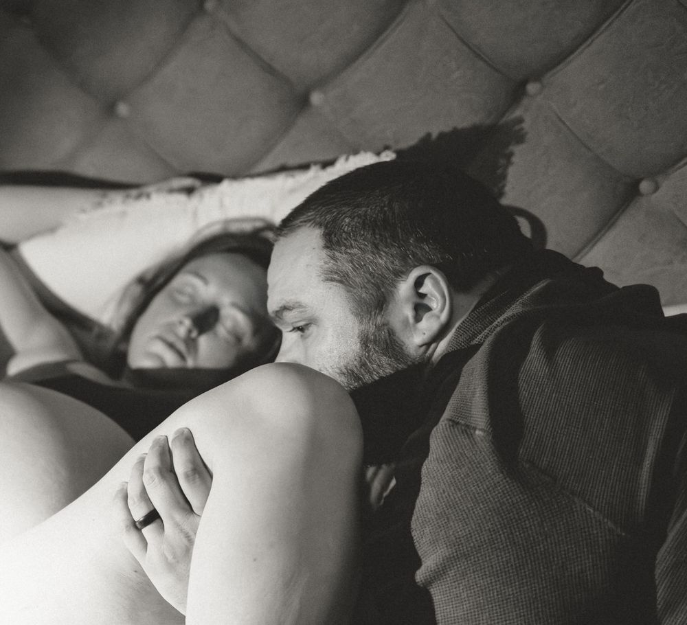 A black and white artistic photo series showing intimate moments between a couple in bed.