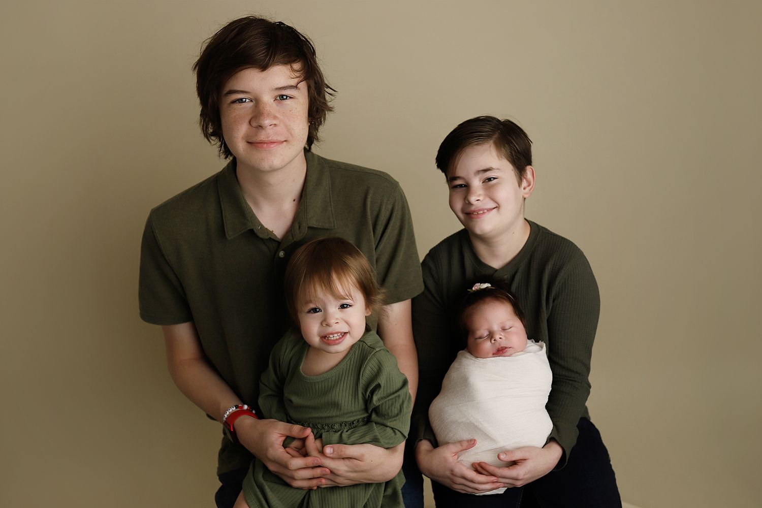 A series of connected family portrait photos showing adults and children arranged in a warm sepia-toned style. Orem Utah newborn photography