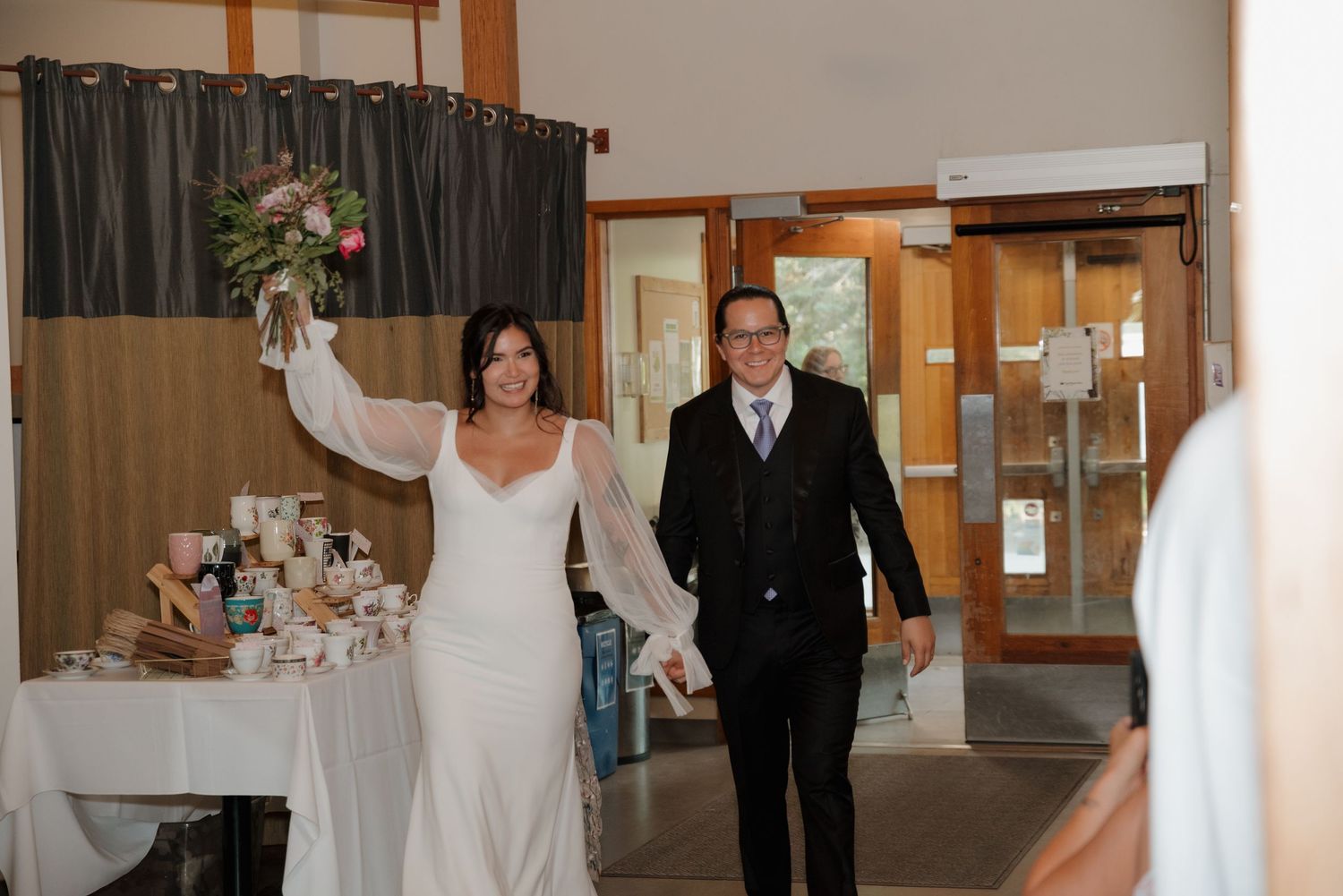 A series of wedding photos displayed in a horizontal collage showing formal attire and venue decorations.