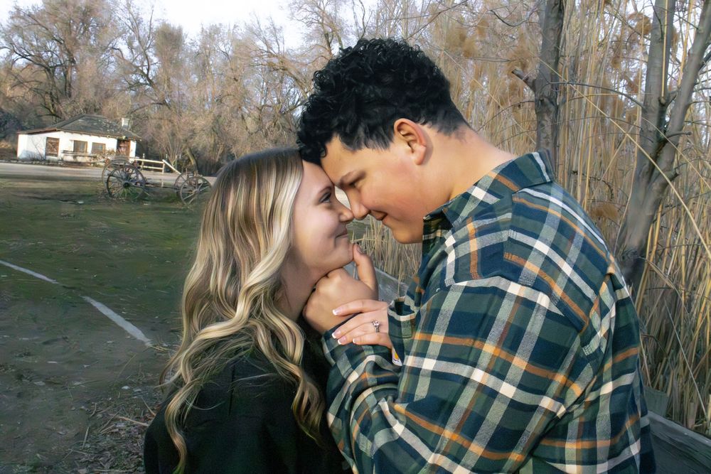 Couple sharing a close moment during a candid engagement photography session