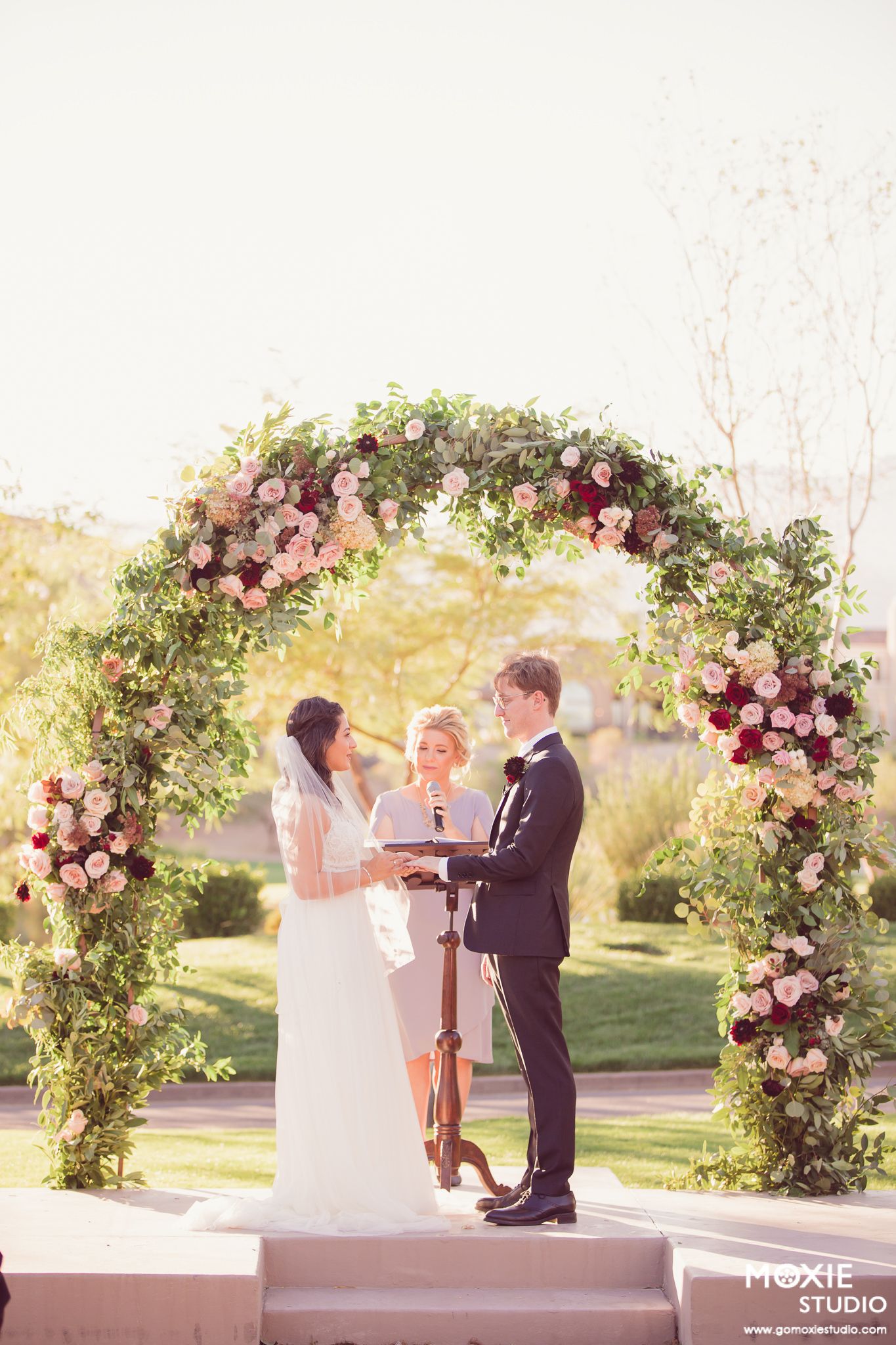 bride and groom portraits at DragonRidge Country Club sunset