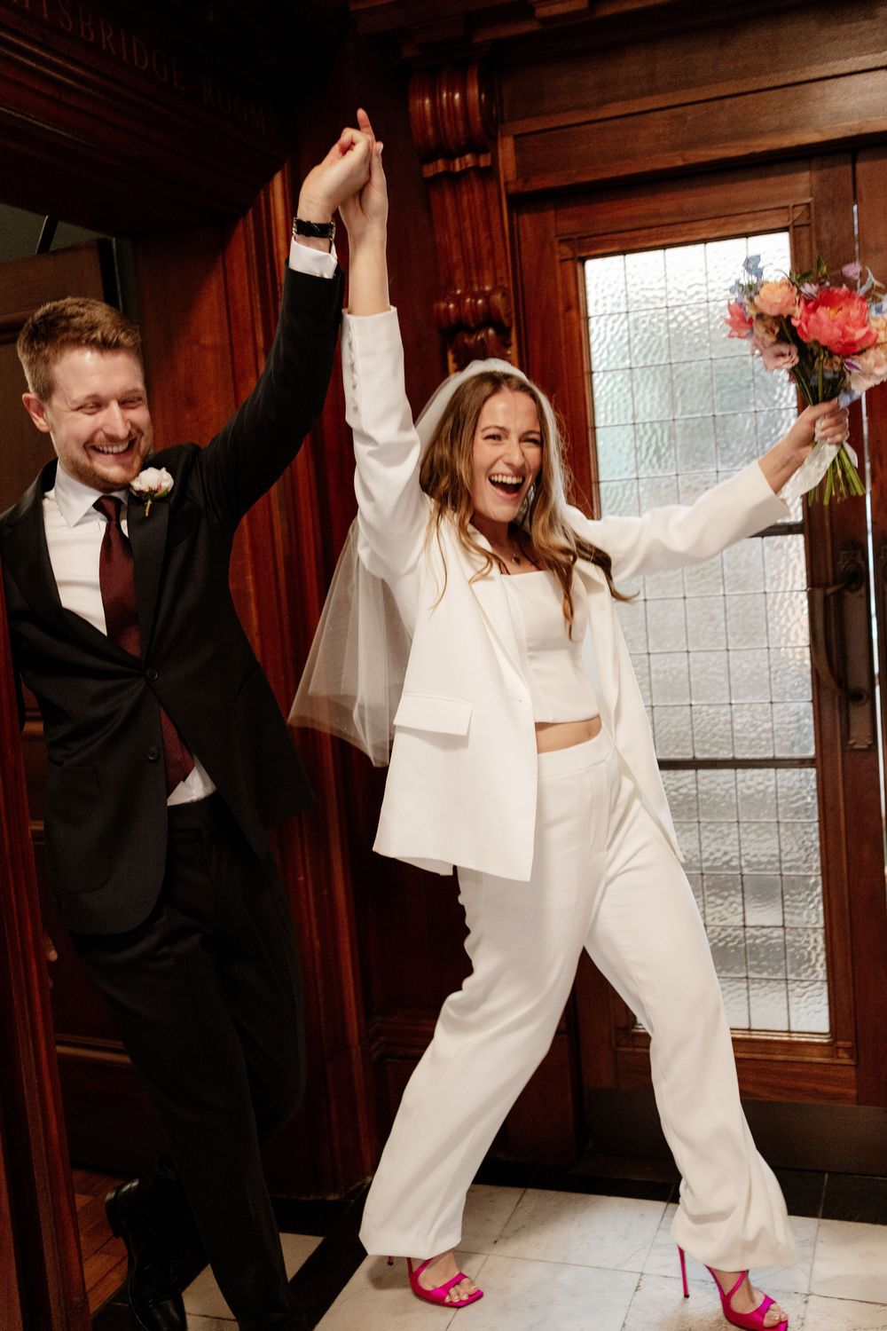 A wedding couple celebrates joyfully in a sequence of four photos showing them dancing and raising their arms in celebration.