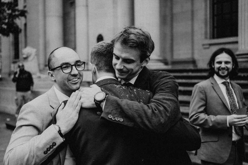 A series of black and white photos showing people laughing and enjoying themselves at a formal event.