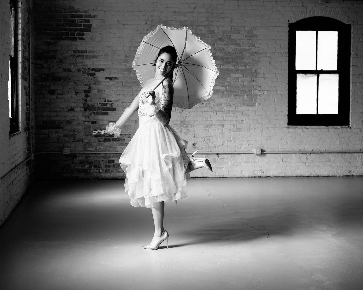 David G Holt Photography - Artistic dance sequence showing flowing white dress movements in an empty industrial space.