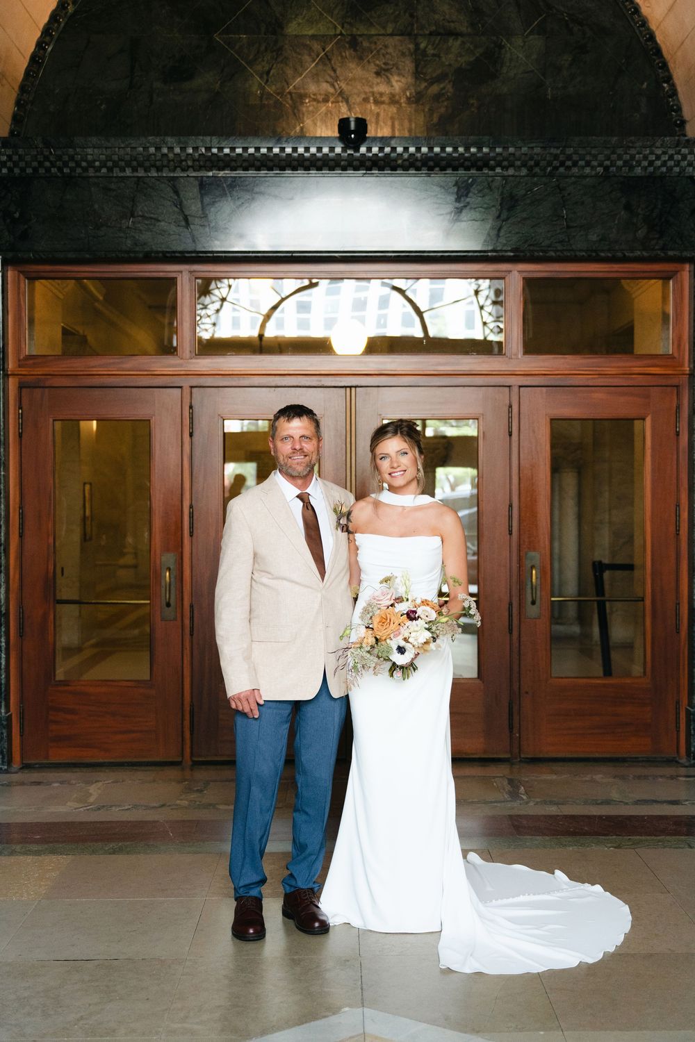 A wedding couple poses in front of wooden doors in a series of sequential photos showing different poses.