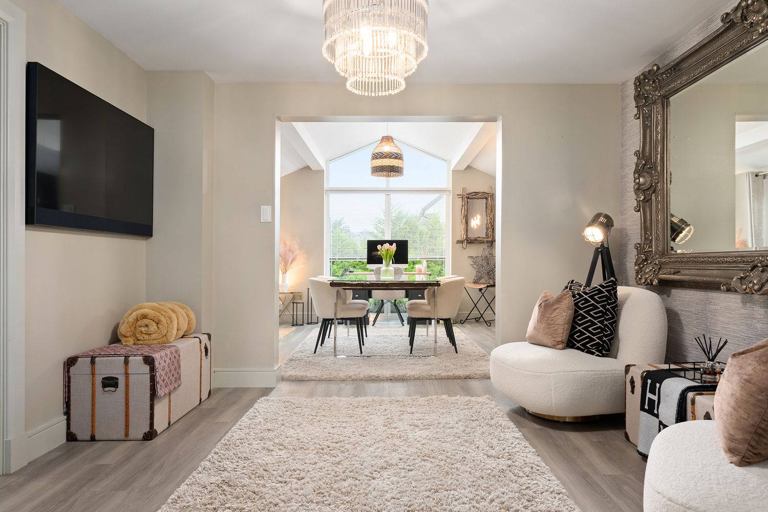 Interior photograph showing interior spaces with open concept lounge and dining area. Modern and luxurious furnishings in a resident setting