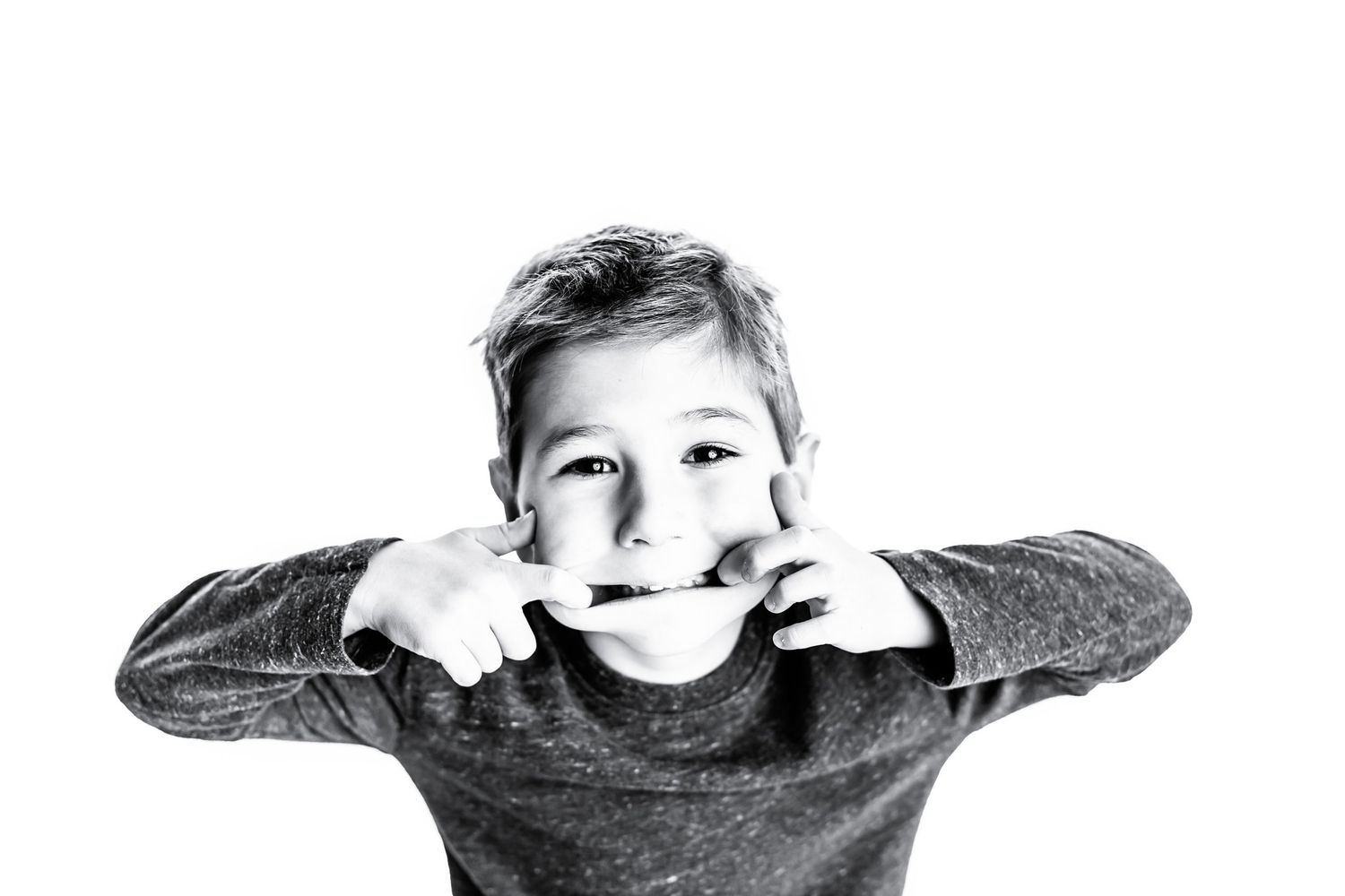 Joyful child being playful during a personality portrait session in Chillicothe Ohio”