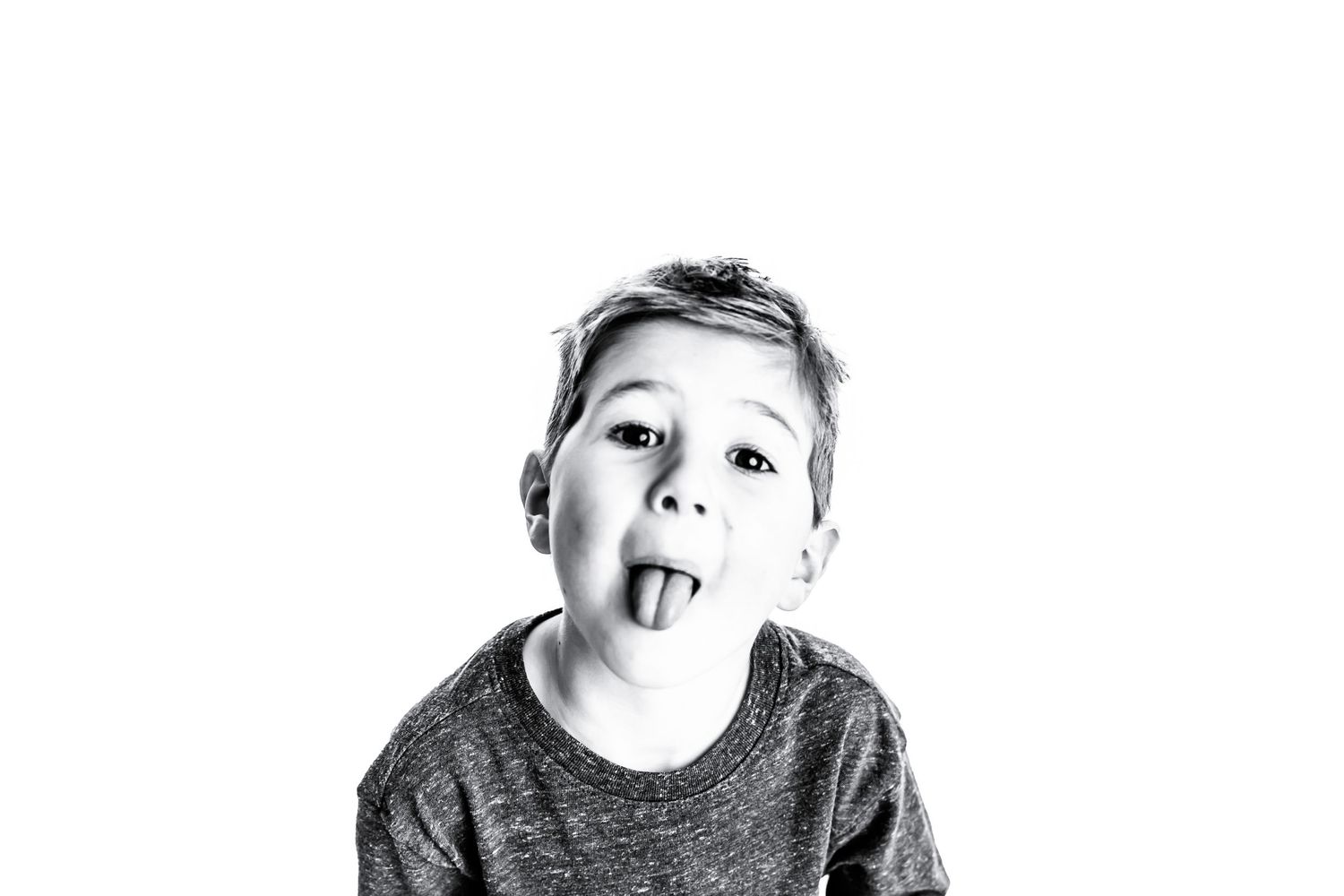 Happy toddler making silly expressions while playing during child photography session in Chillicothe Ohio”