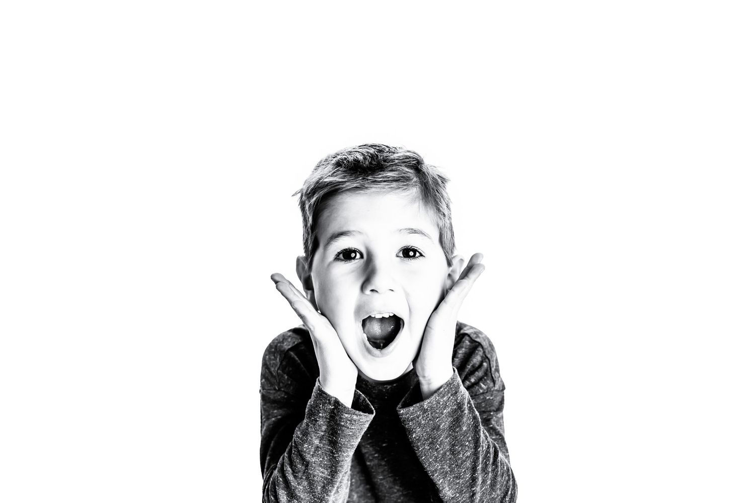 child making a funny face to express himself in Chillicothe ohio newborn photography studio.
