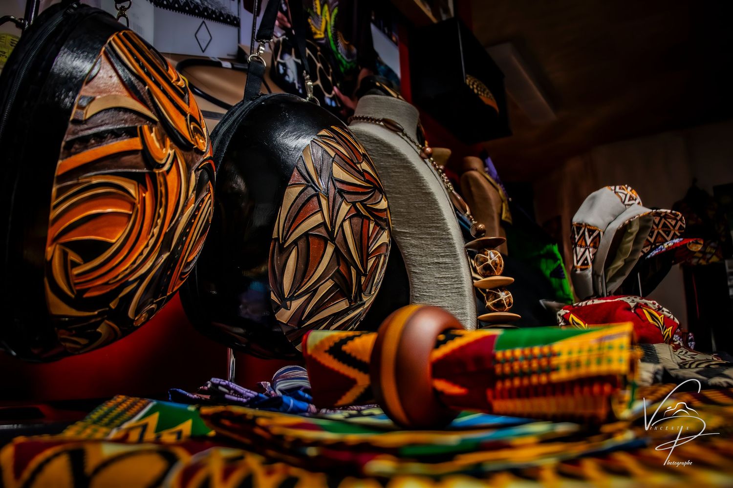 Colorful electronic cables and wires scattered in messy tangle against dark background.