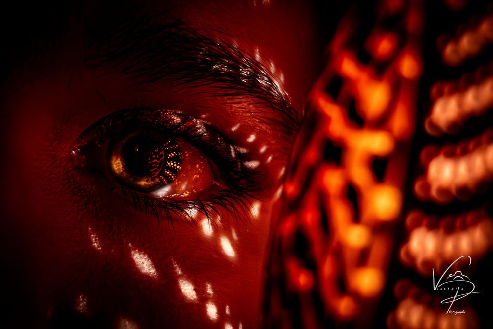Abstract red and orange bokeh lights creating a warm glowing pattern.
