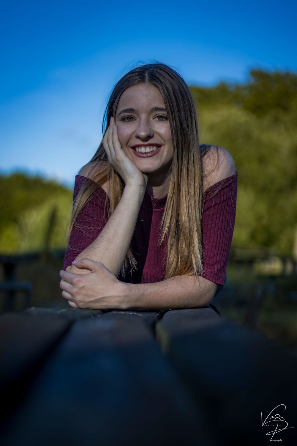 Casual portrait series taken at sunset showing relaxed poses against a dark background.