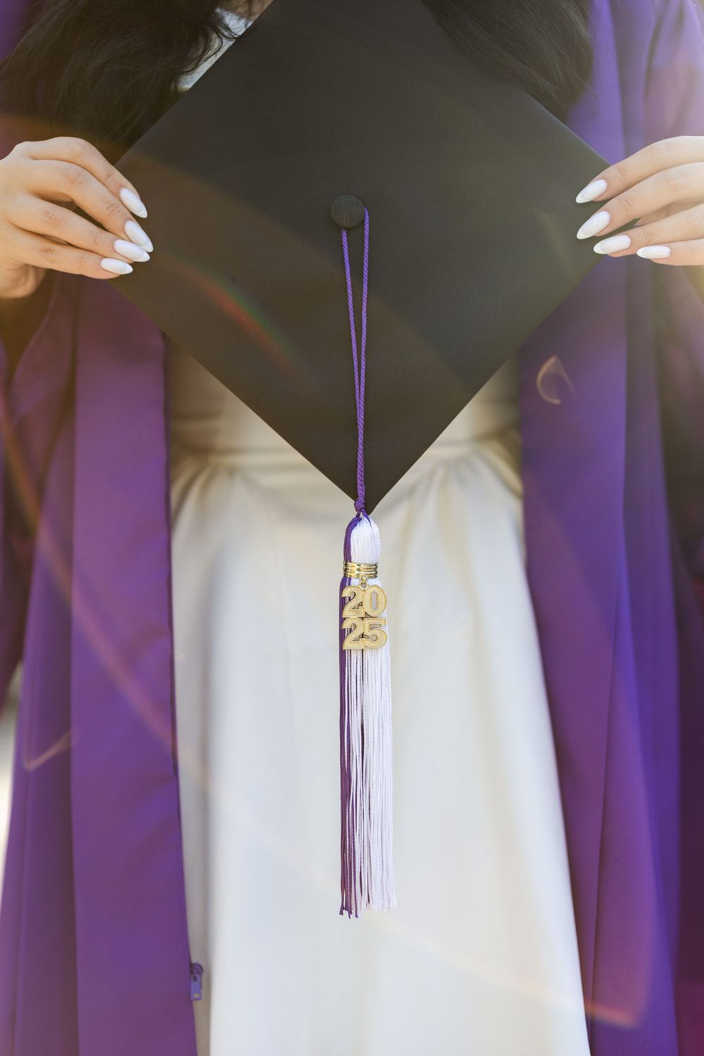 A series of photos showing purple graduation tassels against a white dress in various angles.