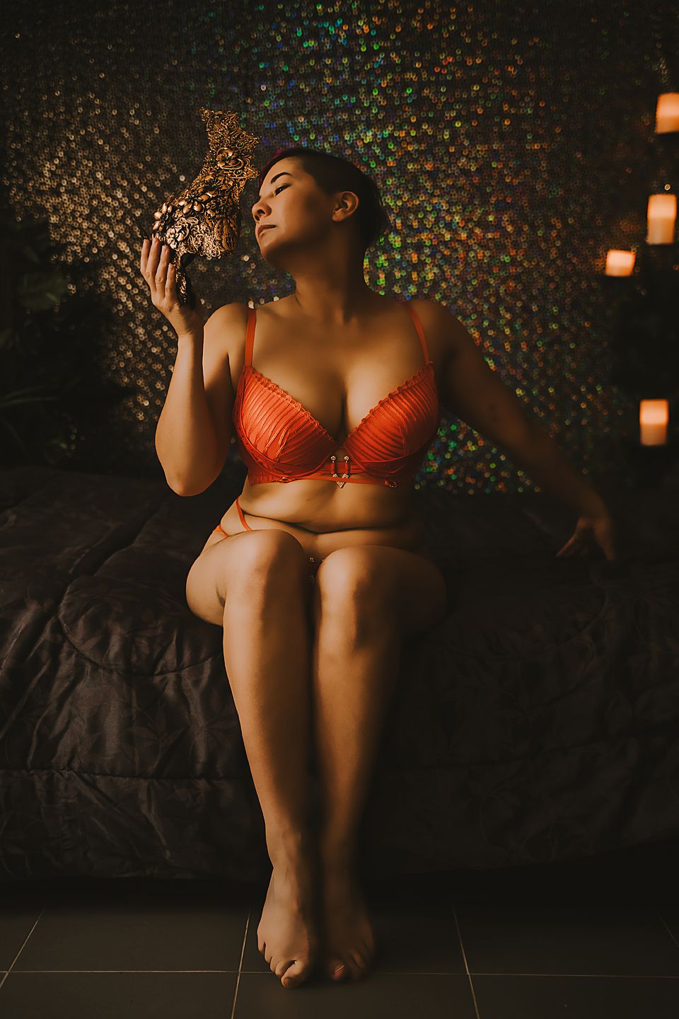 Artistic boudoir photography series featuring dark moody lighting and glittering background effects.