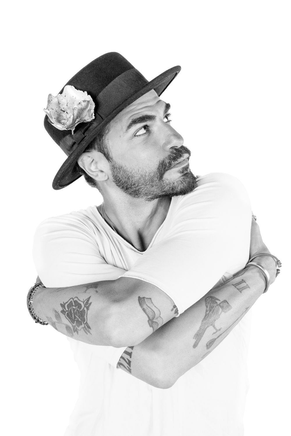 Profile views of person wearing baseball cap in artistic black and white portrait series.