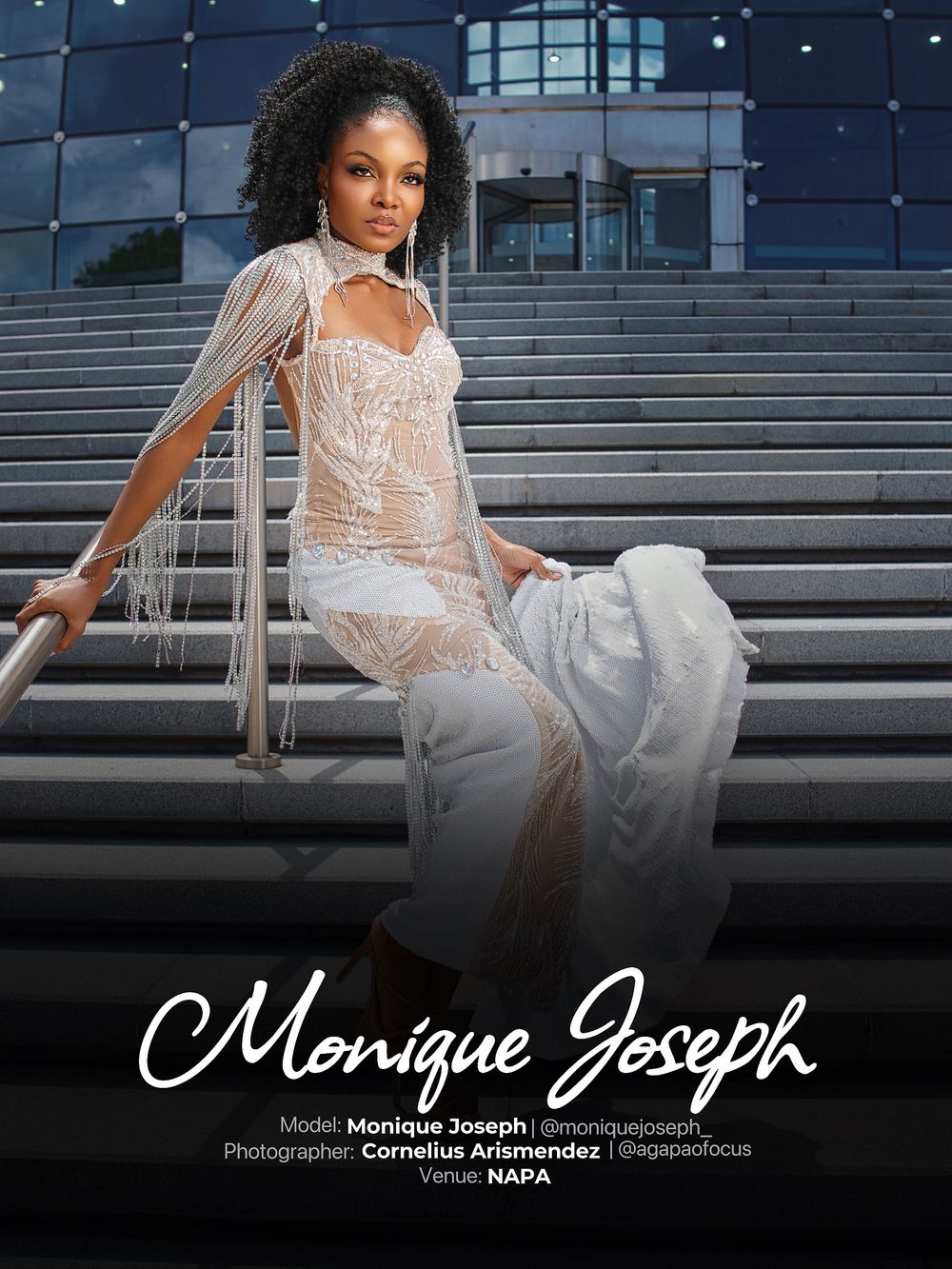 Elegant model in white sheer evening gown poses dramatically on outdoor stone steps at night.