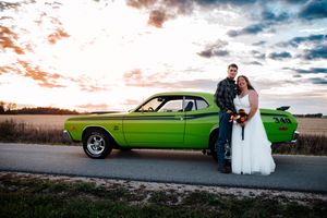 A lime green classic muscle MOPAR car parked at sunset during a wedding photoshoot in Northwest, Ohio.