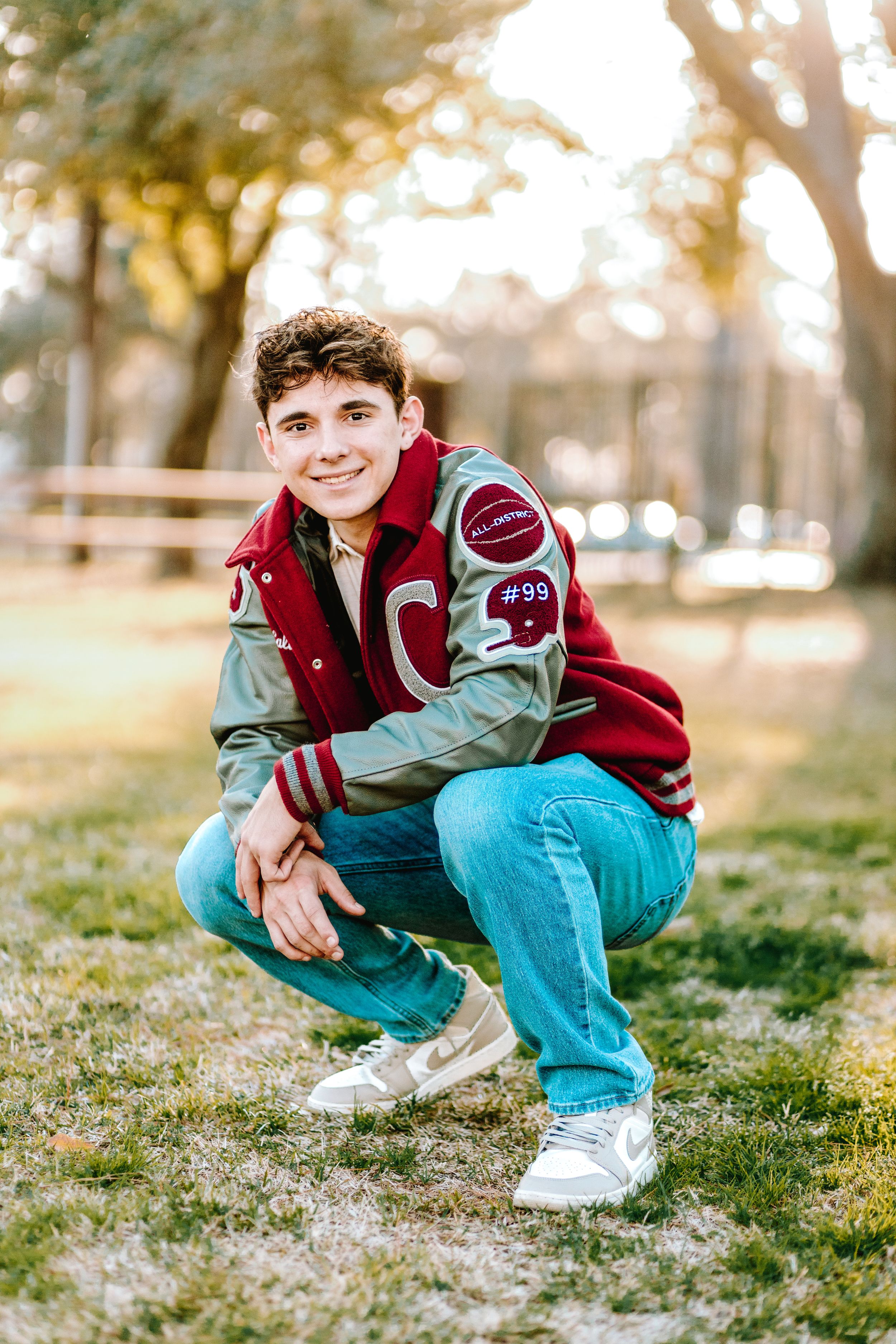 Three similar outdoor photos showing someone wearing a varsity jacket and light blue jeans crouching in grass at sunset.