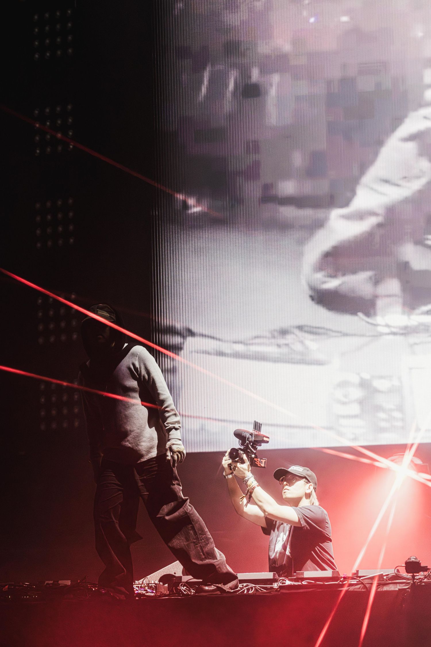A dramatic lightsaber duel scene between two figures silhouetted against a misty dark background with red glowing effects.