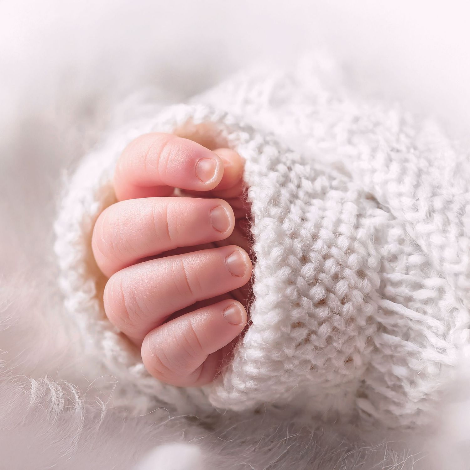 Tiny hands of a newborn baby
