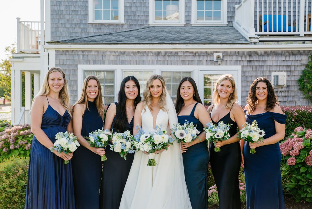 Capture beautiful moments with bridesmaids, showcasing stunning navy blue dresses, heartfelt laughter, and candid memories.