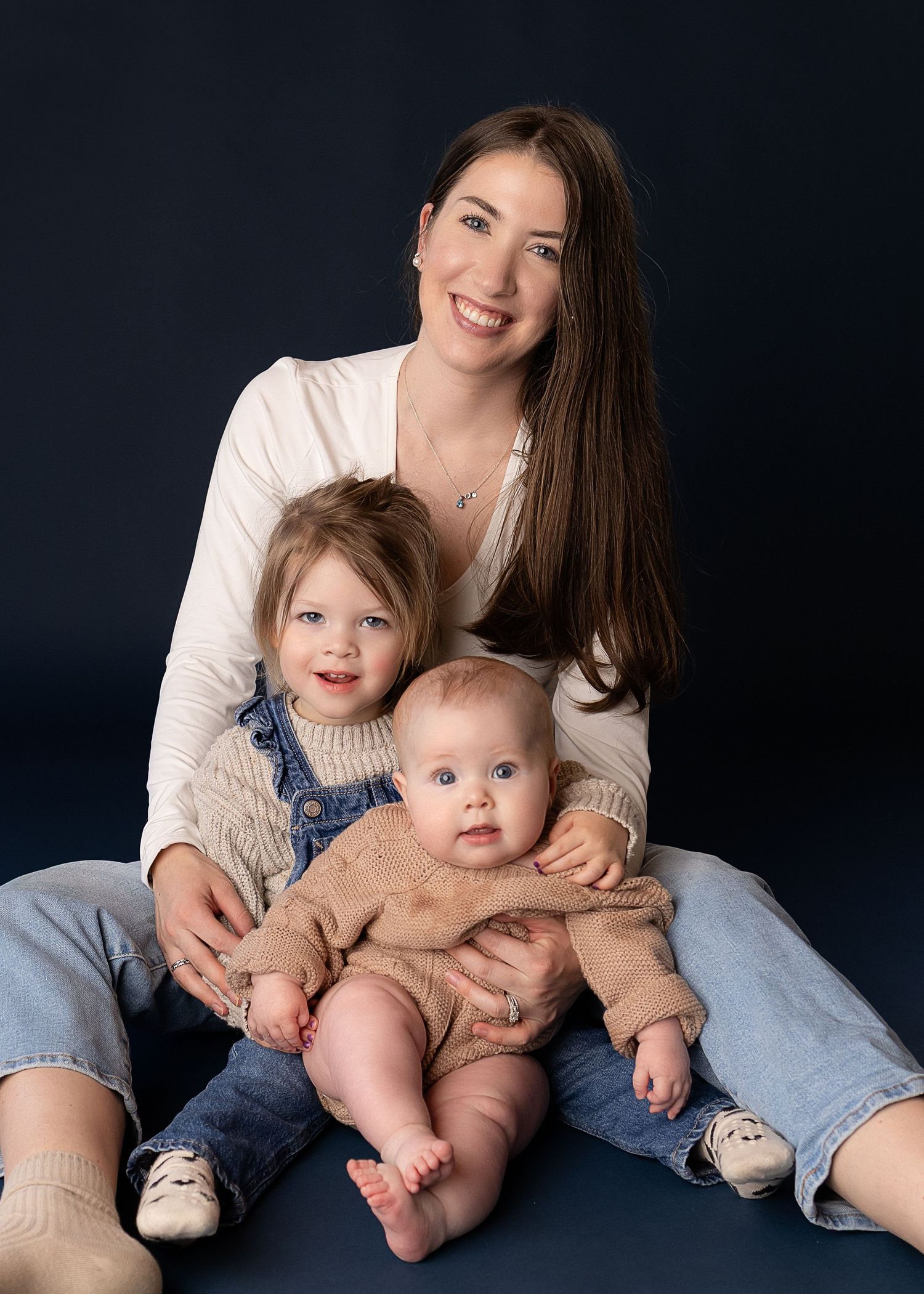 Professional photo of a mother with her two daughters