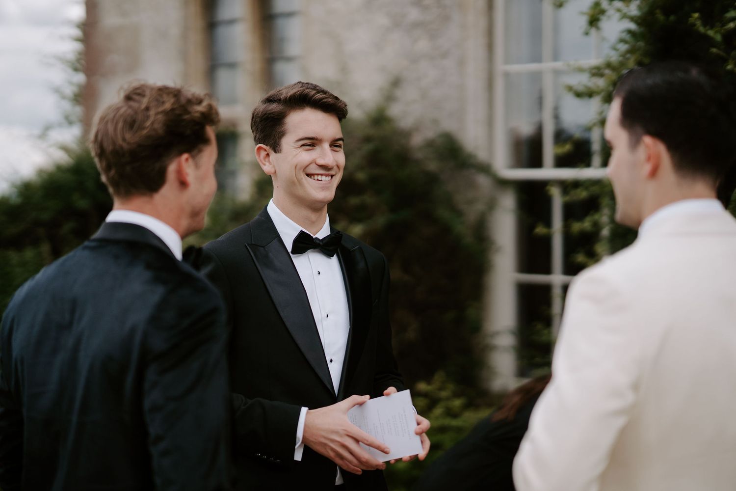 groomsmen talking and laughing at Hamswell house in bath