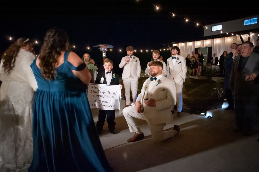 Sparkler exit celebration at a wedding reception venue with blue lighting.