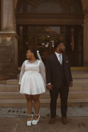 A candid series of photos showing a family's feet and lower bodies in formal wear against a stone building.
