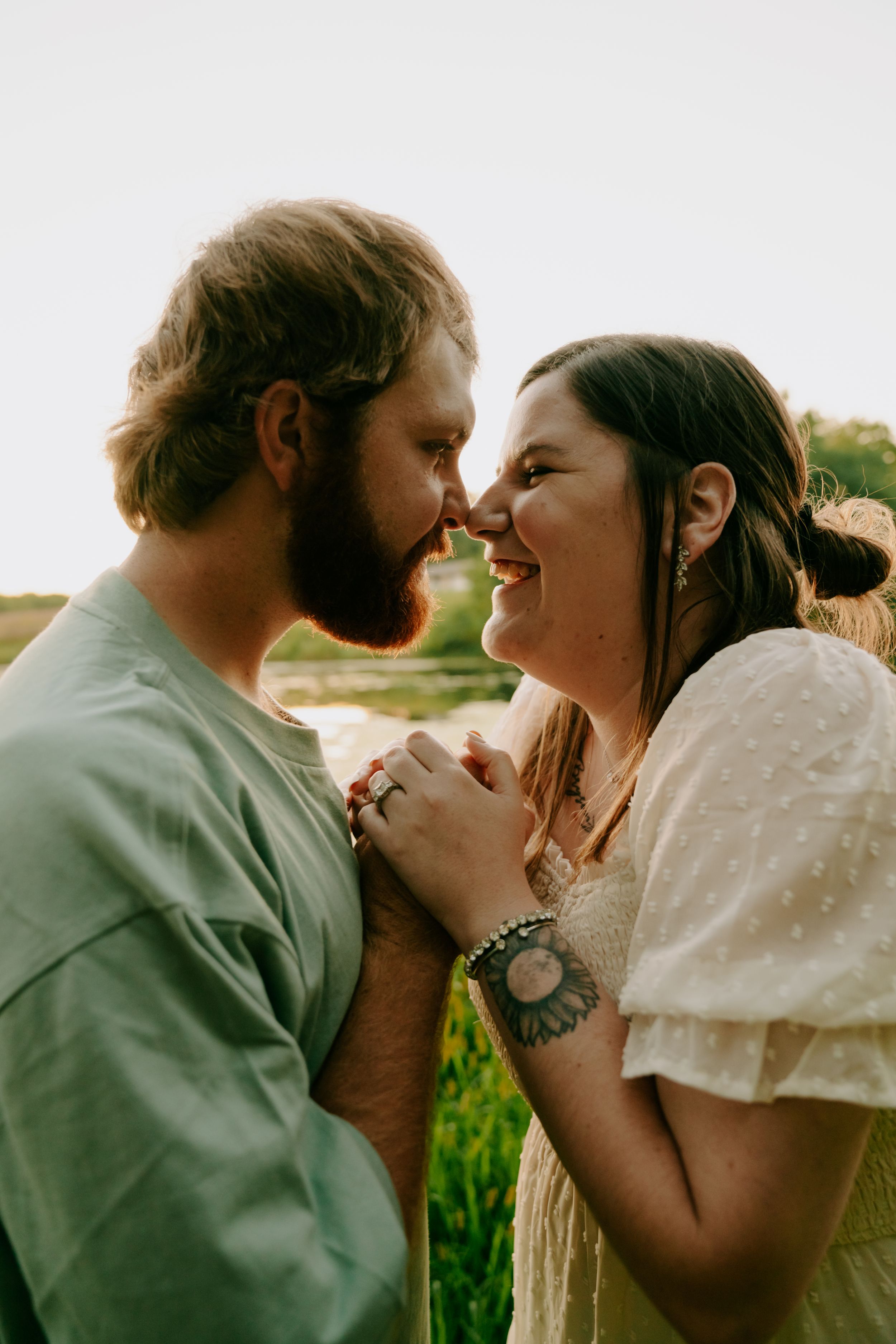 A romantic couple shares intimate moments in a series of close-up shots during golden hour.