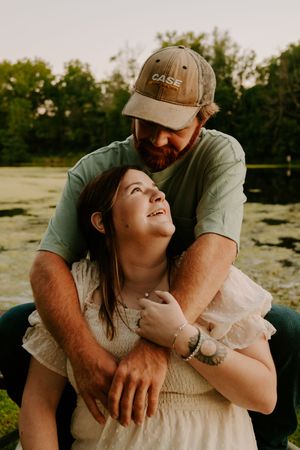 An intimate outdoor portrait sequence showing affectionate moments at dusk.