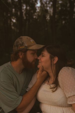 An intimate series of photos showing affectionate moments in dim evening light.