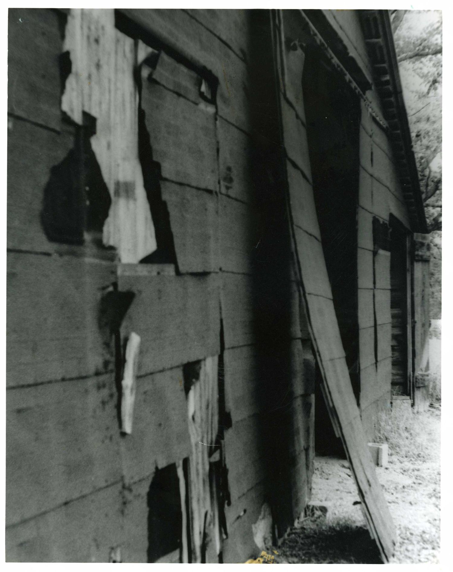 A series of black and white photos showing an angular shadow cast on wooden boards.