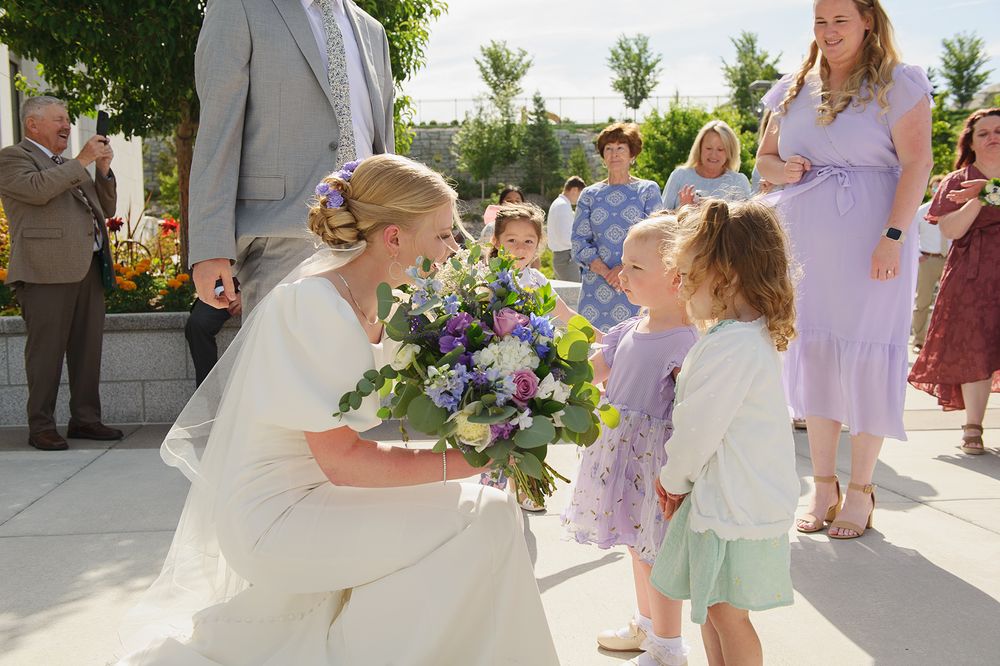 Blackfoot wedding photographer ShutterGirl   candid photo of bride coming out of Pocatello Idaho temple