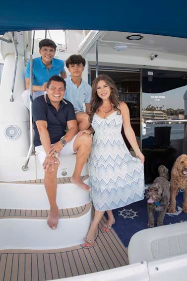 Luxury family photography session at Lido Village, California on family yacht