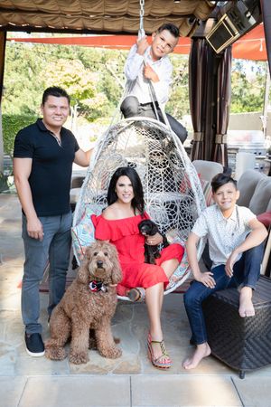 Relaxed family photos on in their backyard with their dogs in Tustin, California