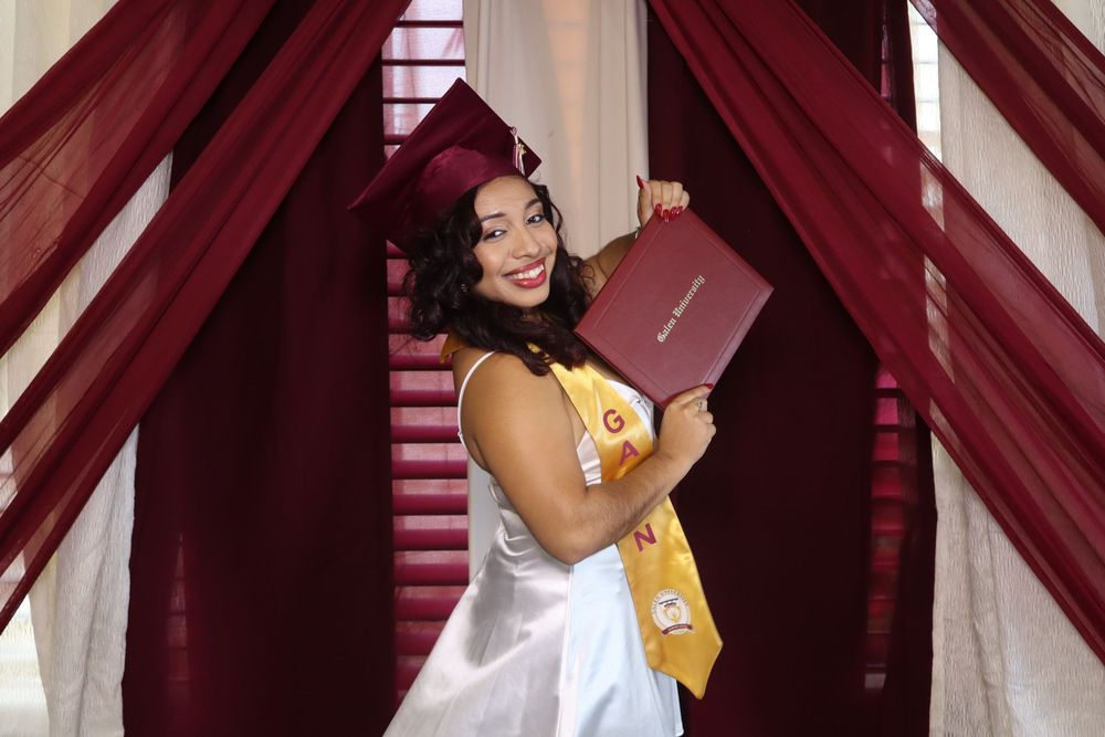 Proud graduate showing off her well deserved diploma at the photo Booth!!