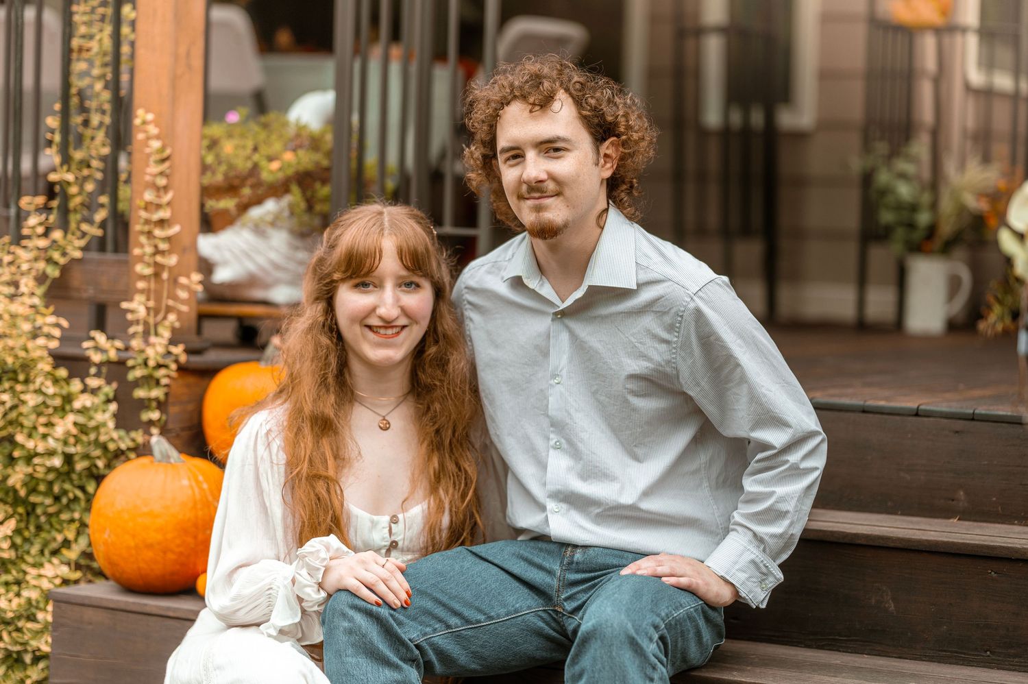 An intimate outdoor couples portrait with moody winter scenery in the background.