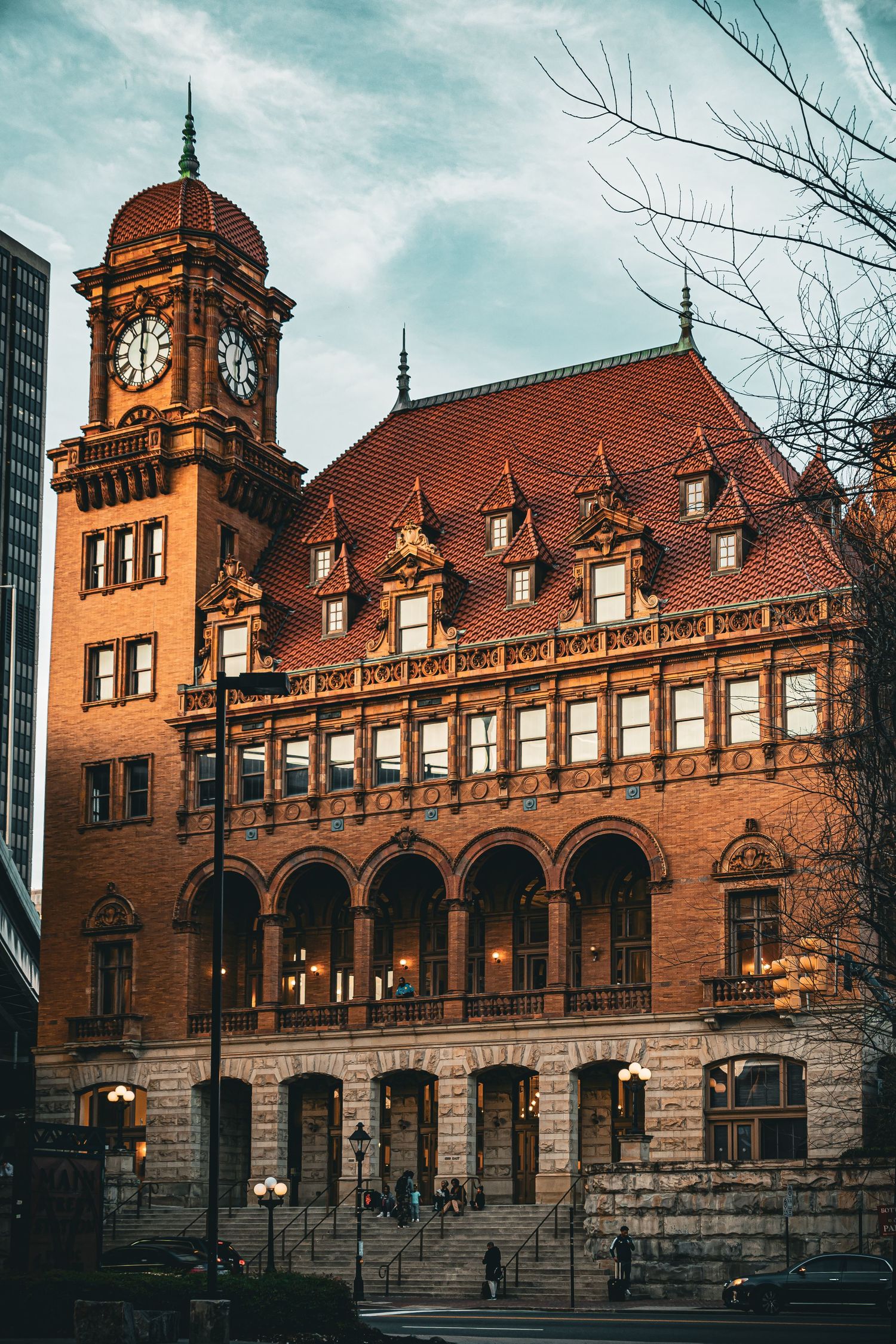 Historic Main Street Station in Richmond Virginia features ornate red brick architecture with arched windows and a clock tower.